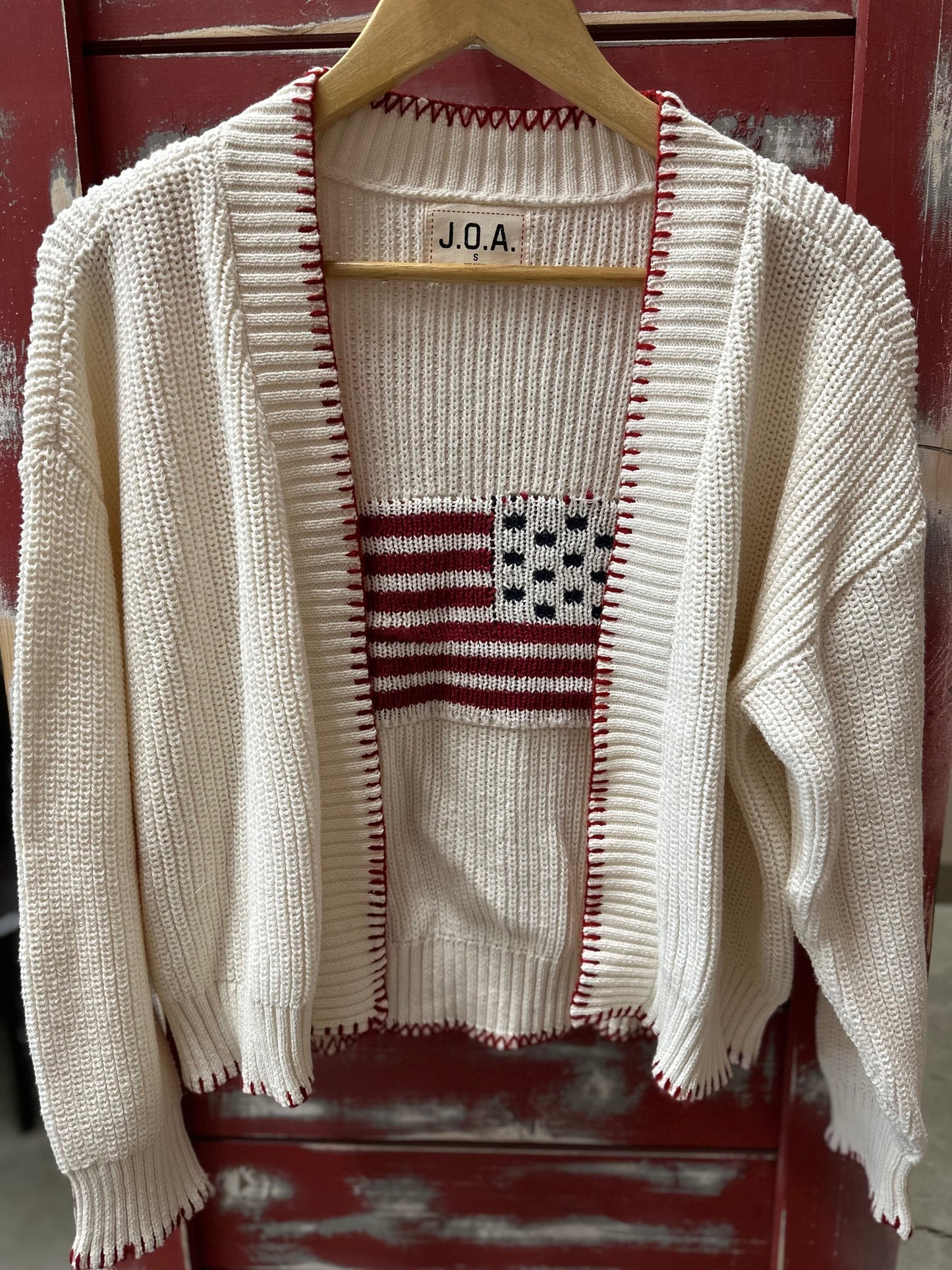 LONG SLEEVE KNIT CARDIGAN W/ AMERICAN FLAG ON BACK