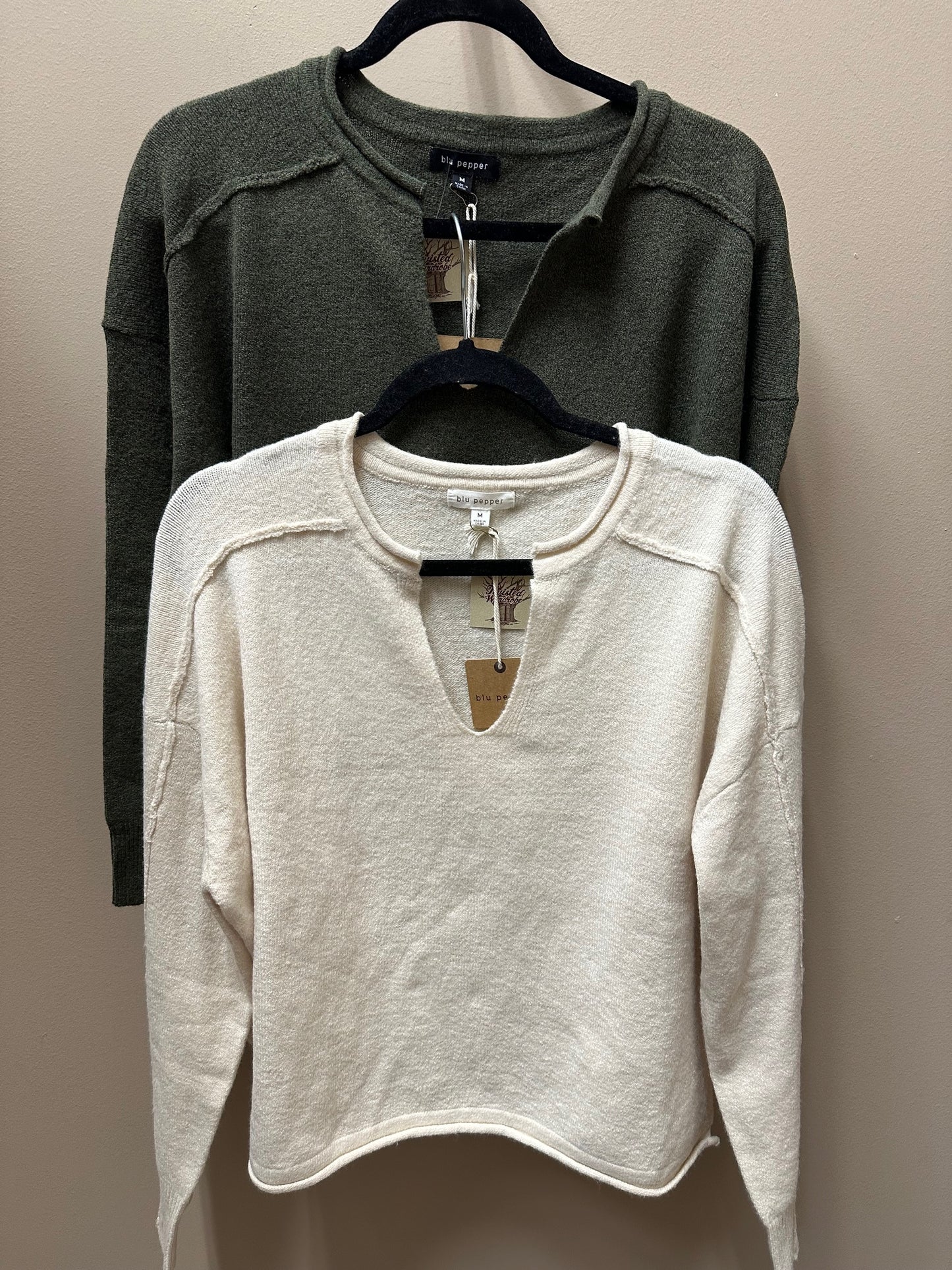 EXPOSED SEAM SPLIT NECK KNIT SWEATER