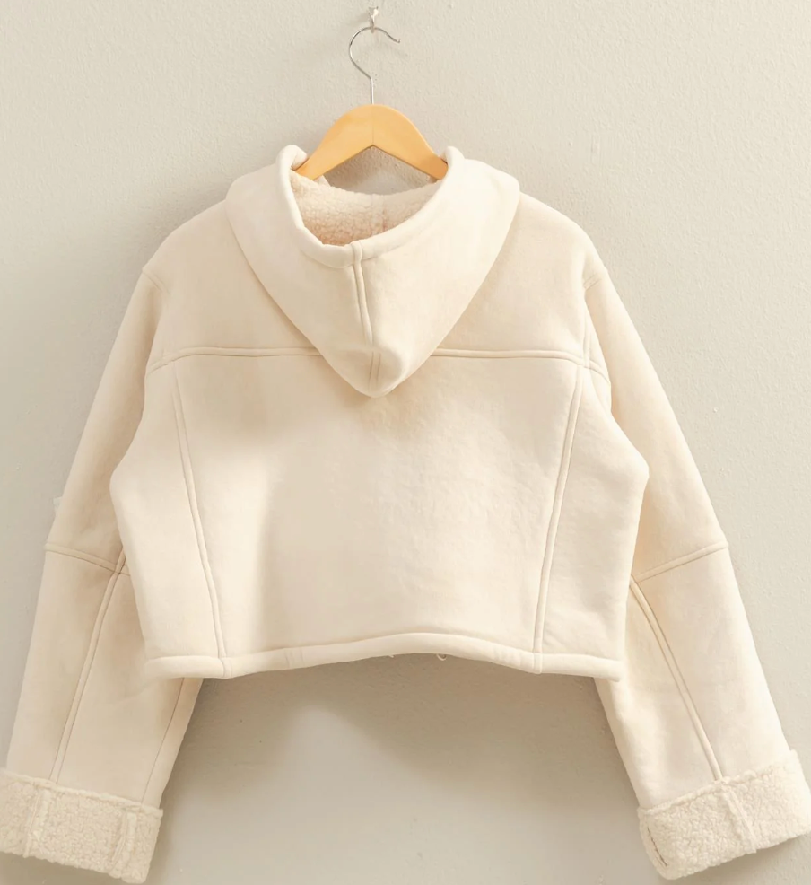 FAUX JACKET HAS ZIP UP FRONT AND HOODIE